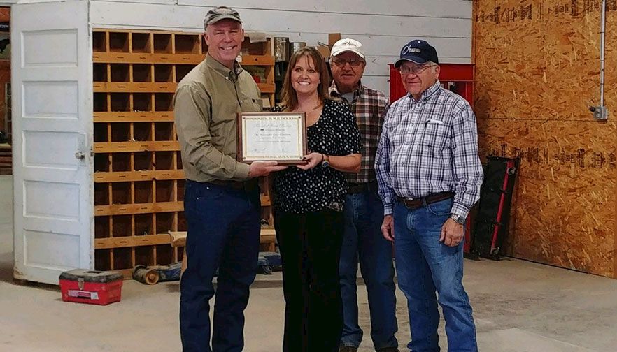 Congressman Greg Gianforte accepts the Friend of Farm Bureau Award from Nicole Rolf, Montana Farm Bureau, and Doug and Keith Arntzen, Arntzen Angus.